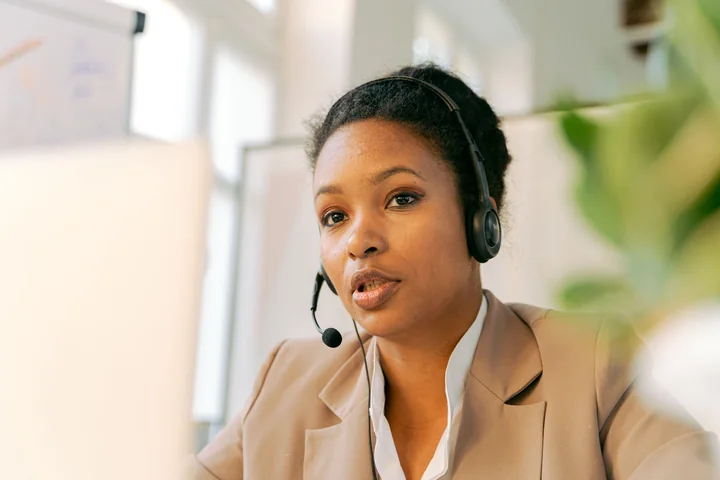 Customer service professional wearing a headset in an office