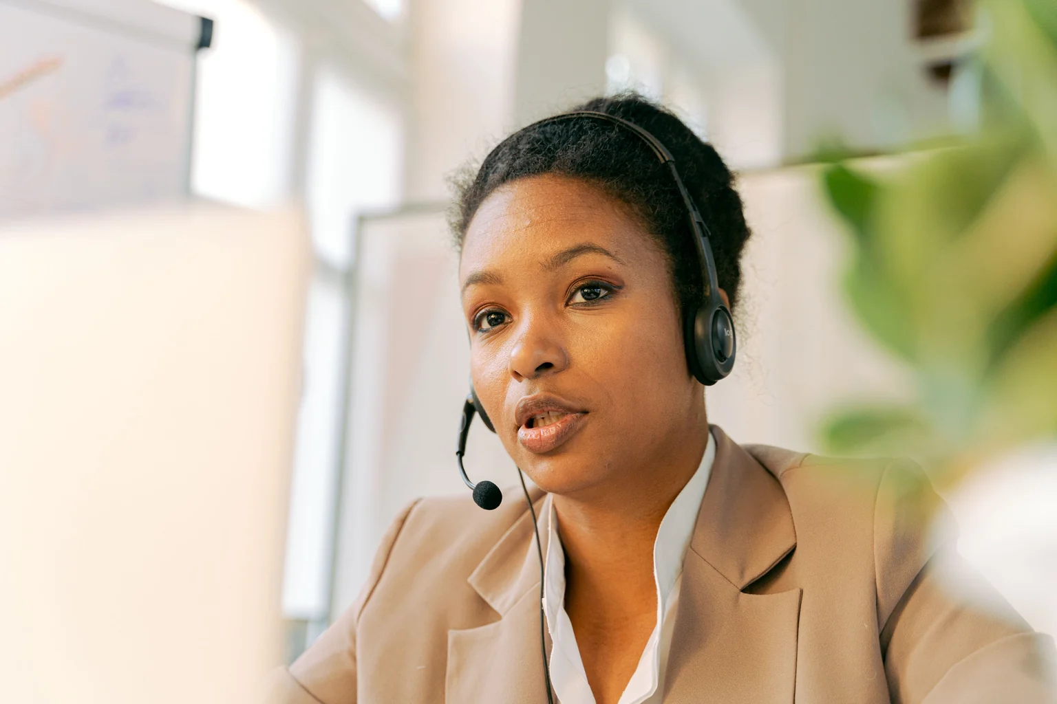Customer service professional wearing a headset in an office